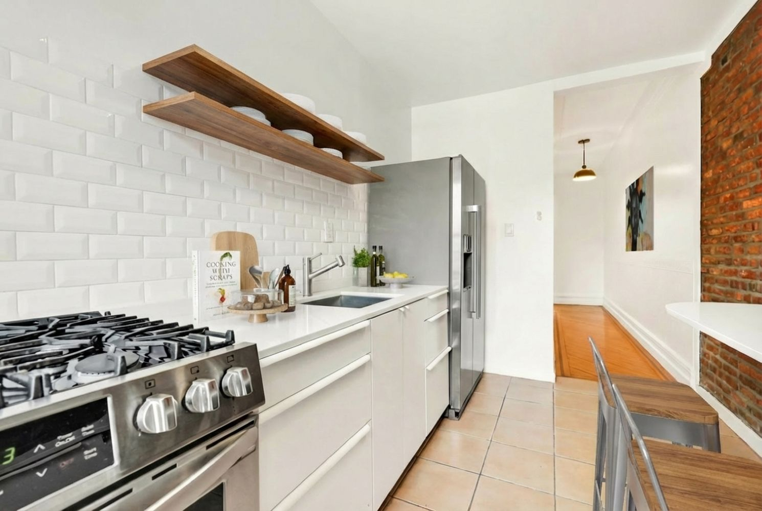 kitchen with tile floor, white cabinets