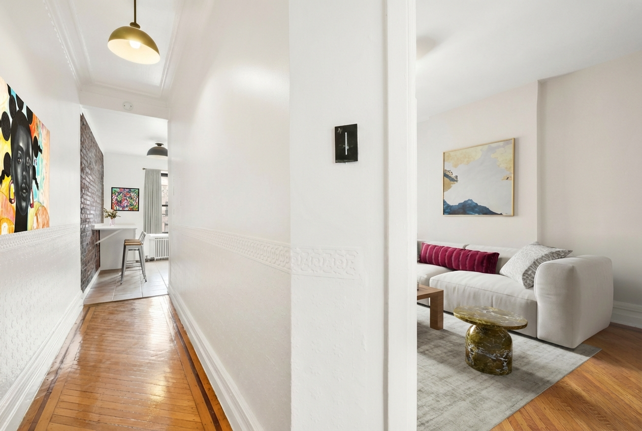 hallway with wood floor and view to the kitchen