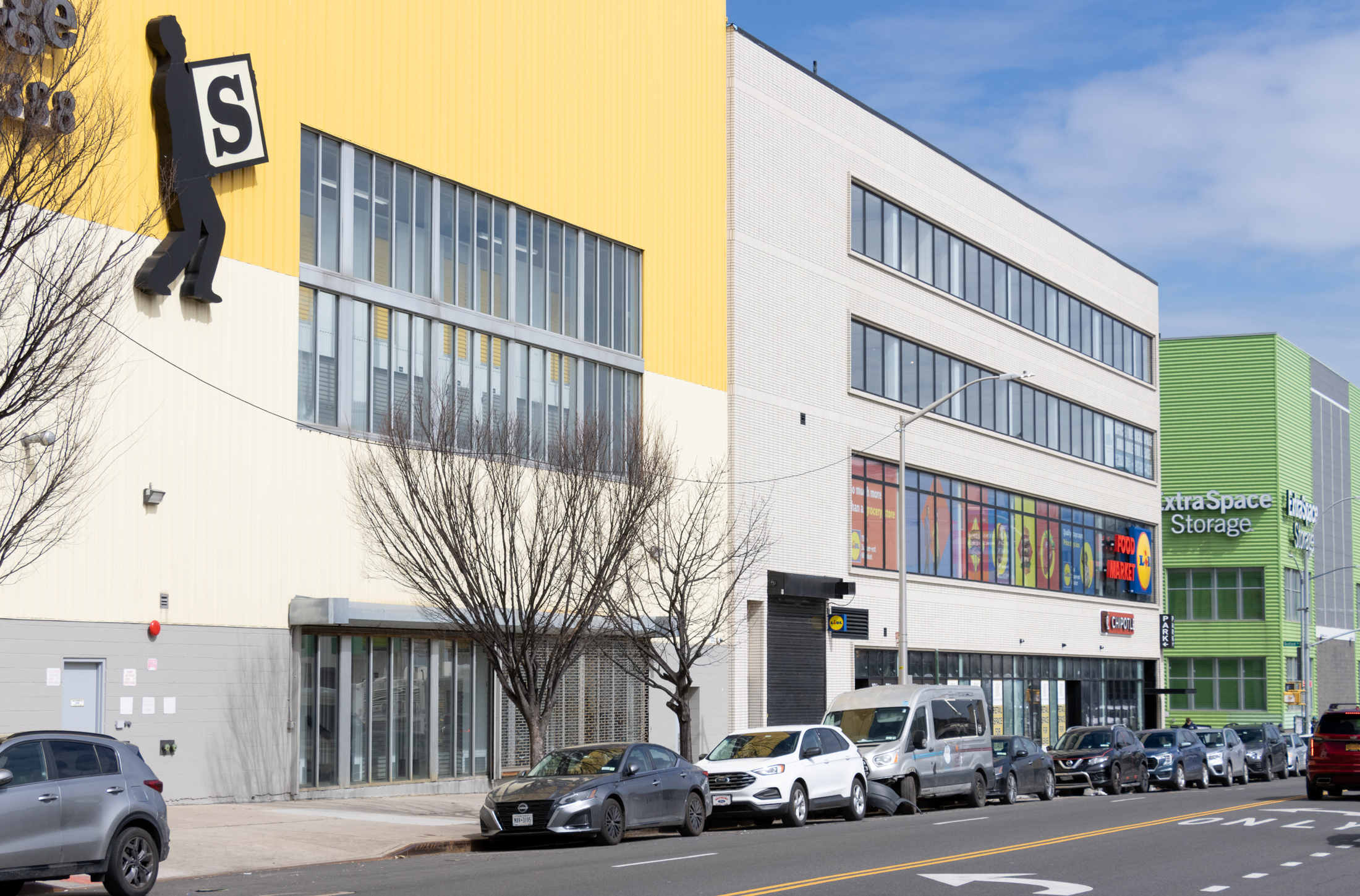 view on empire boulevard with new pale brick building