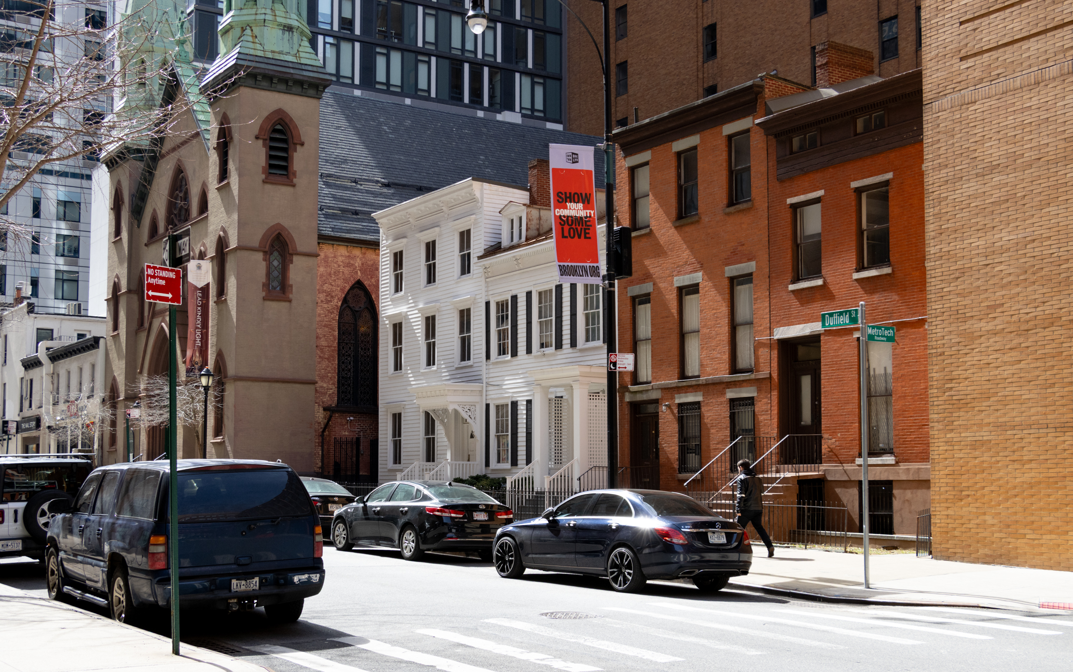row of wood frame and brick houses