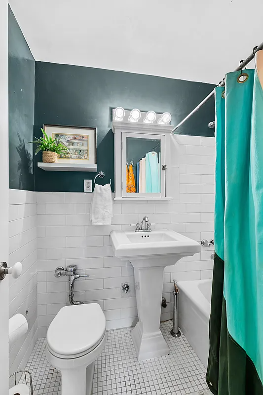 bathroom with white fixtures and tile