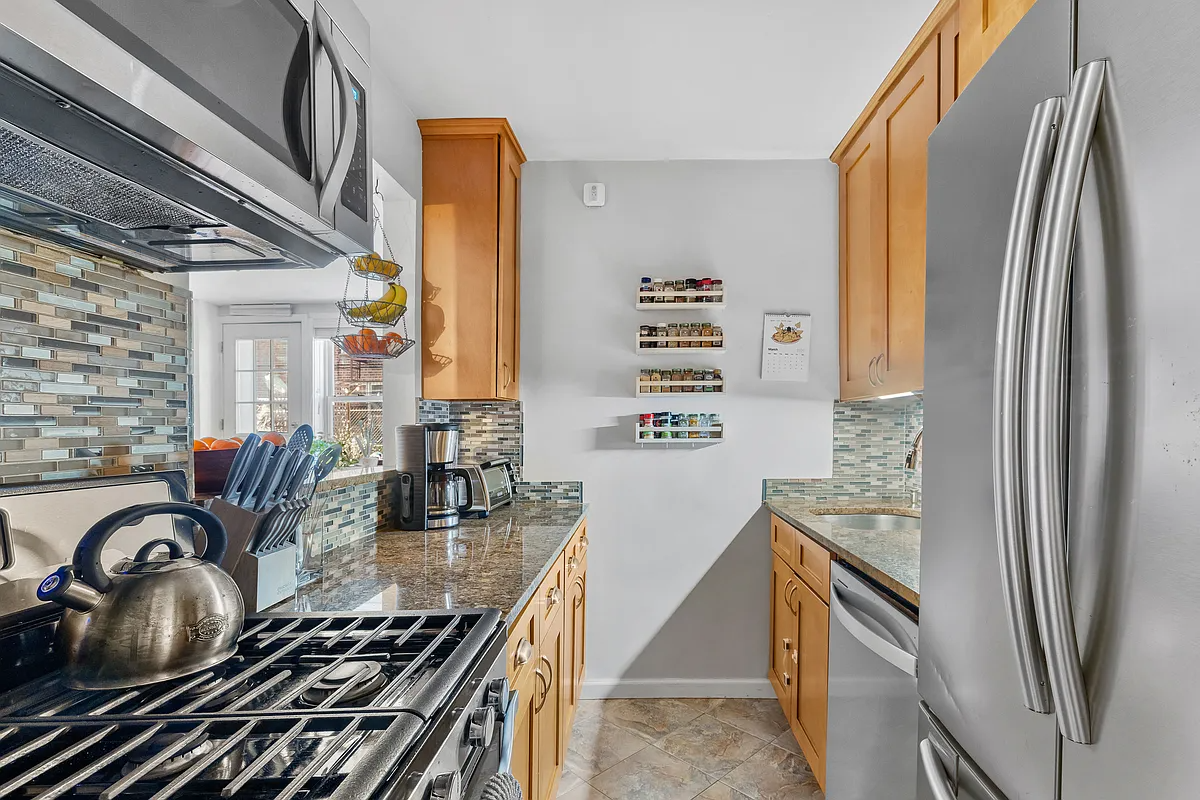 galley kitchen with wood cabinets