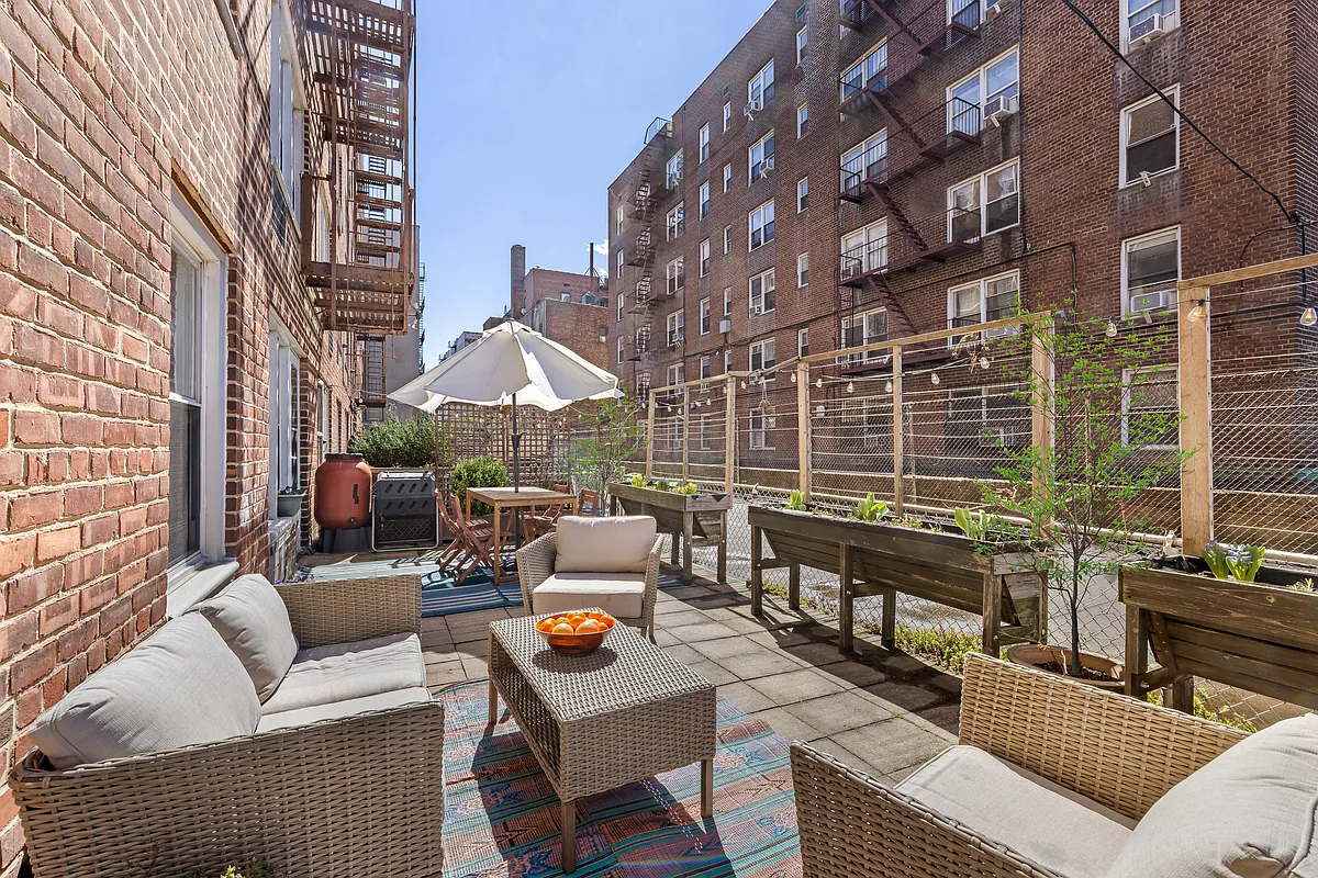 terrace with seating area, dining area, and planters