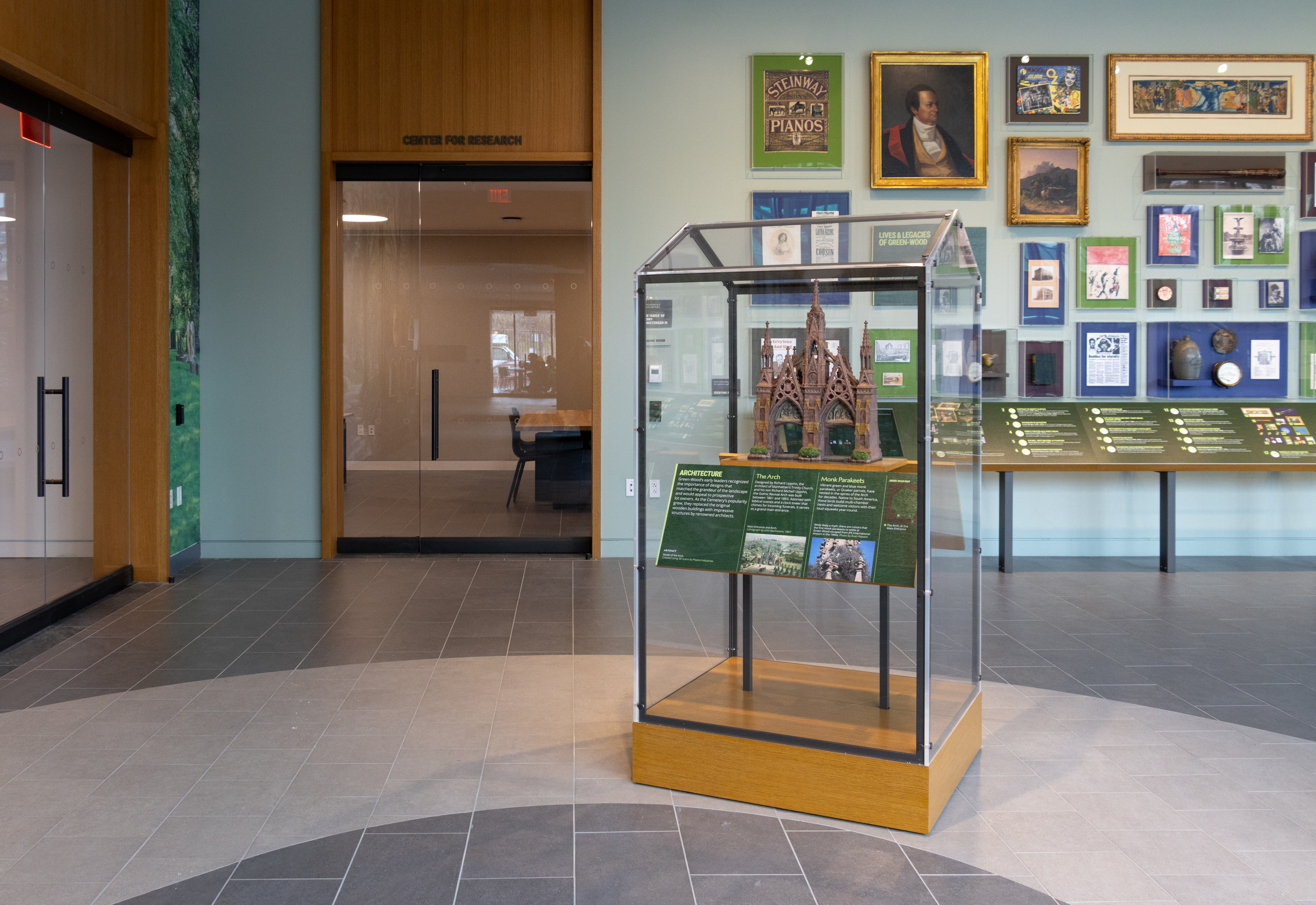 exhibition space with paintings and objects