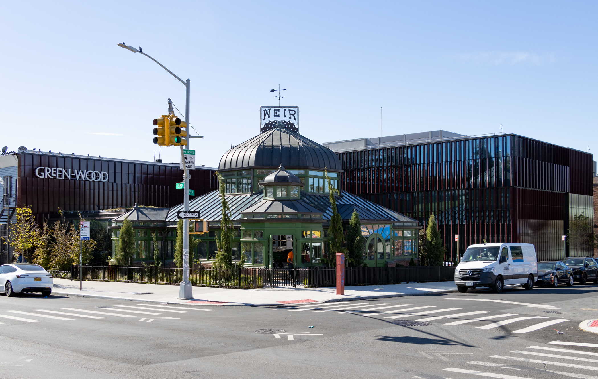 19th century Green-house with new buildings around it