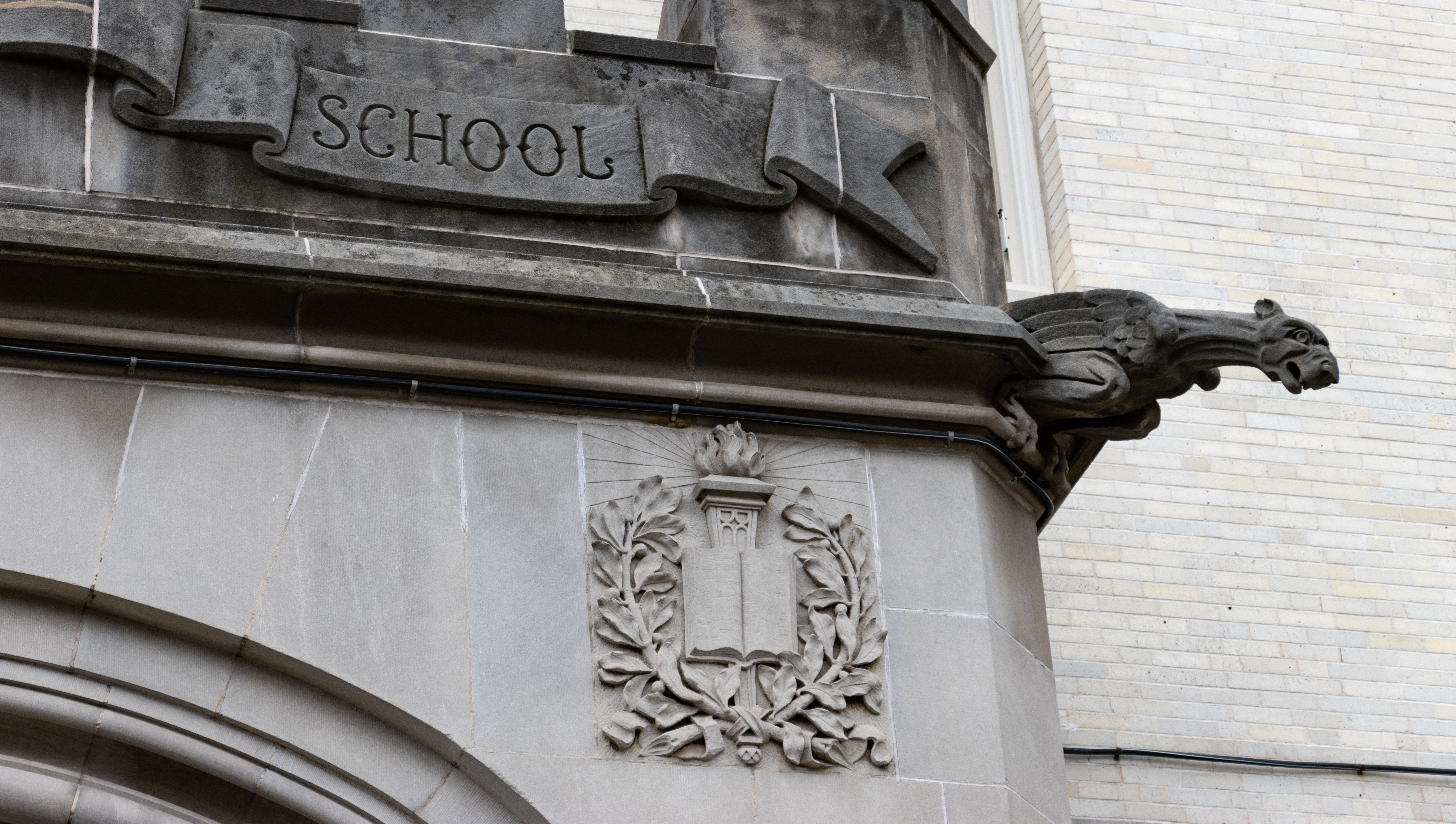 a gargoyle on a school building