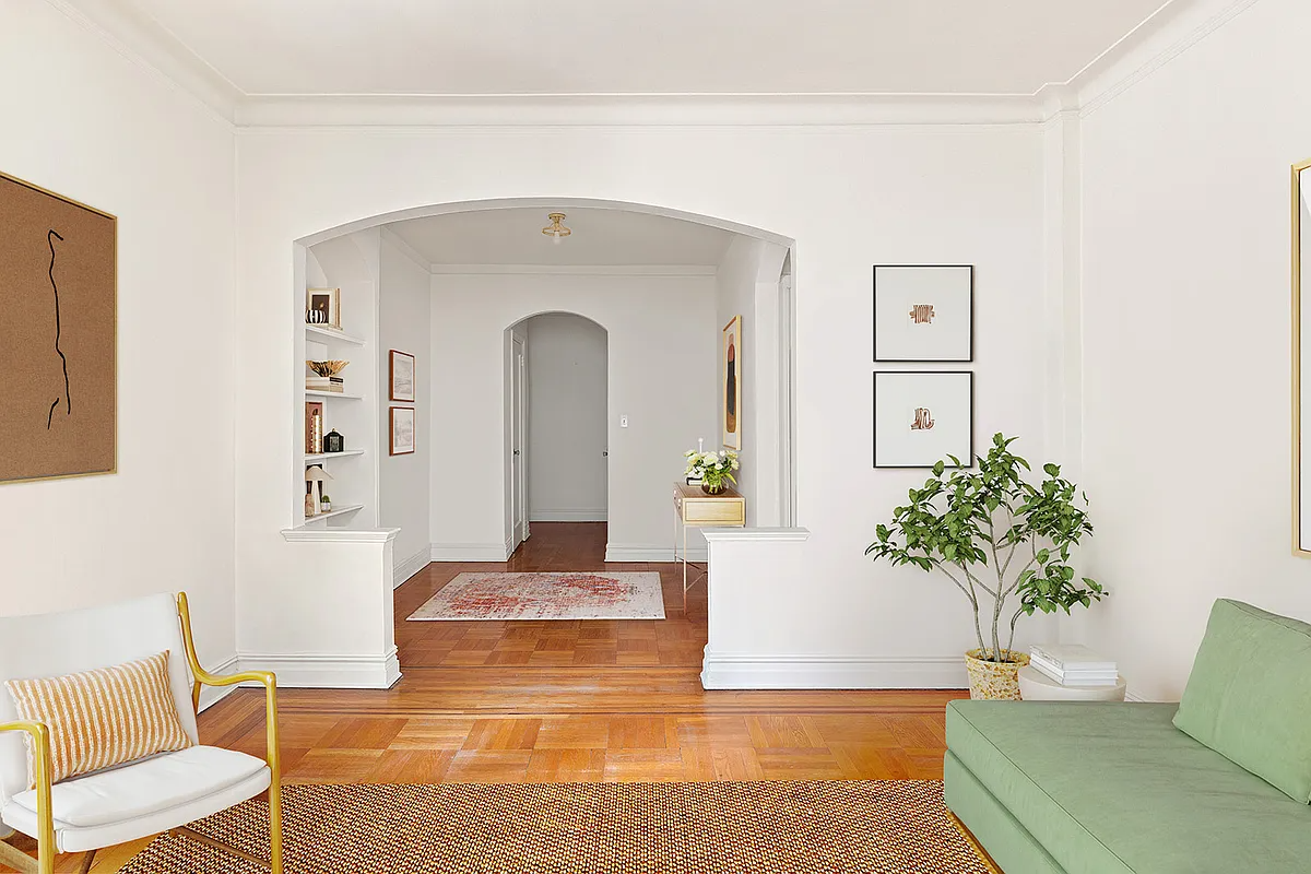 virtually staged view from living room with white walls, wood floors