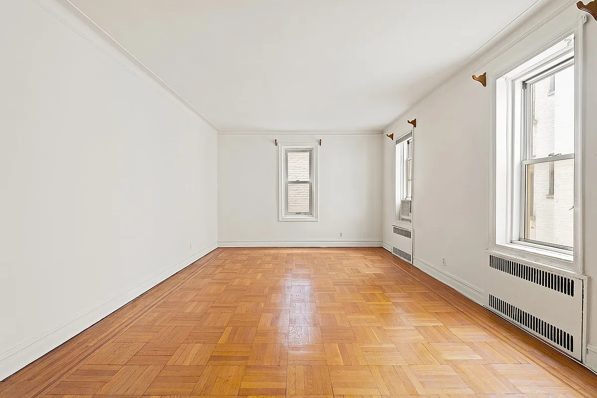 living room with two exposures, wood floor,