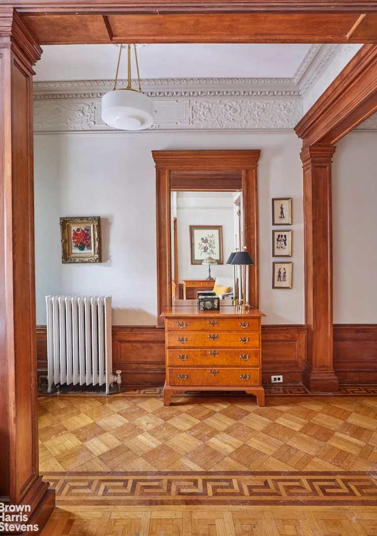 entry hall with plasterwork, wood floors