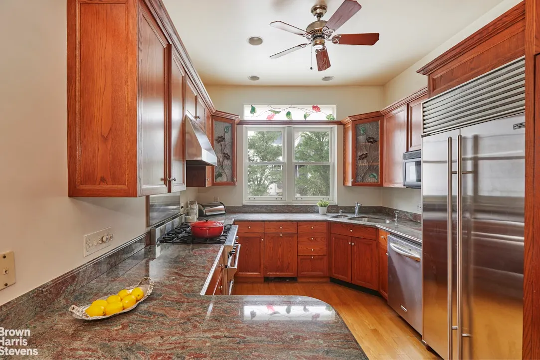 kitchen with wood cabinets, corner sink