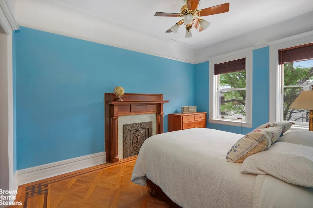 bedroom with mantel, blue walls
