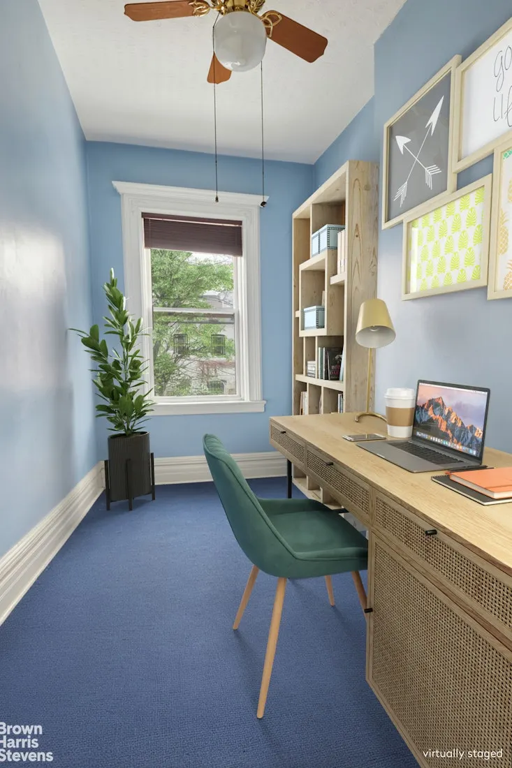 virtually staged narrow bedroom set up as an office