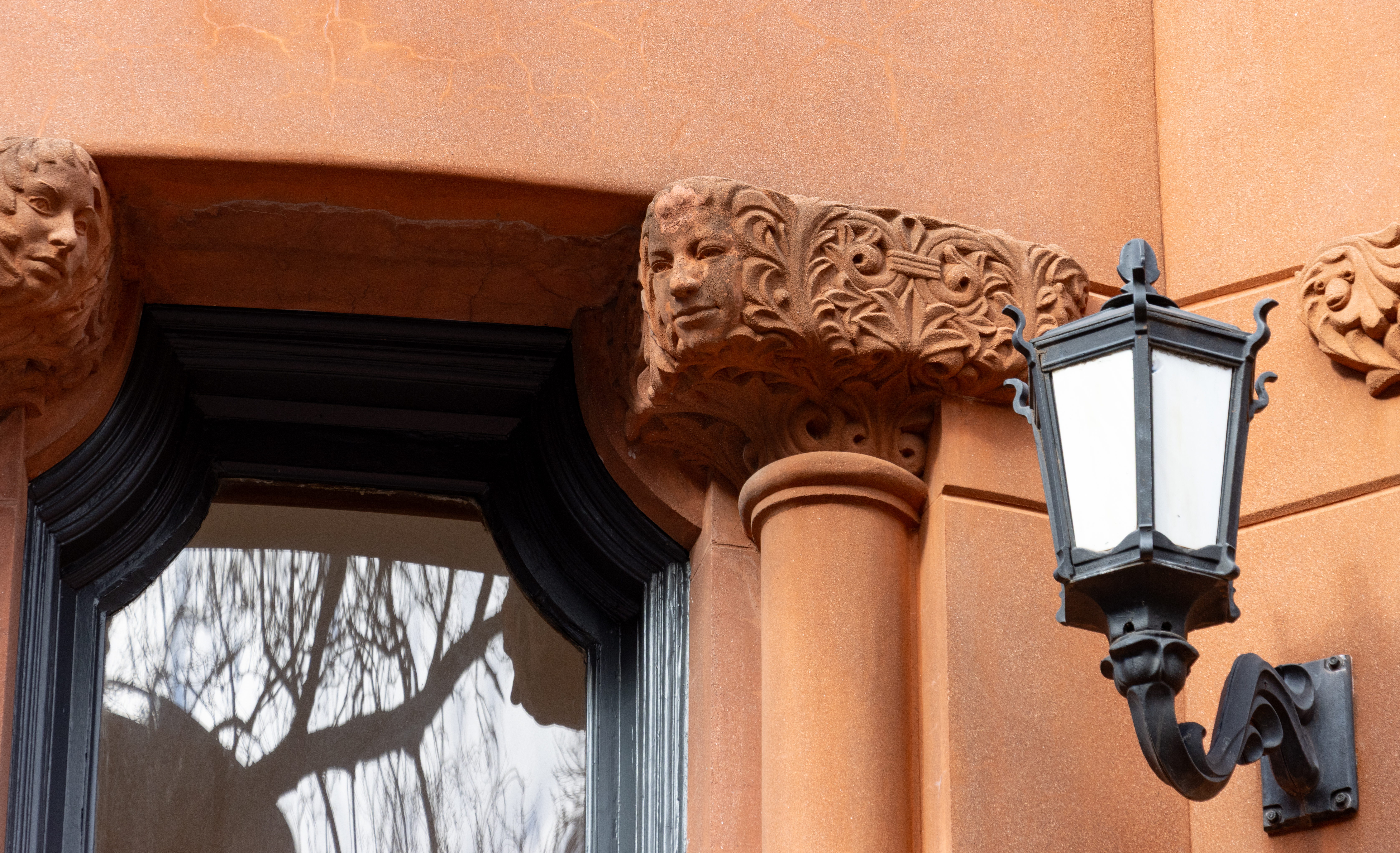ornament, including carved faces, on a brownstone