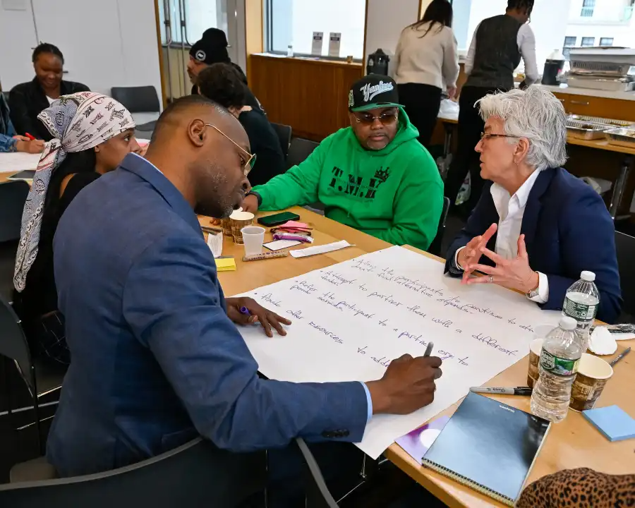 group talking while sitting at a table