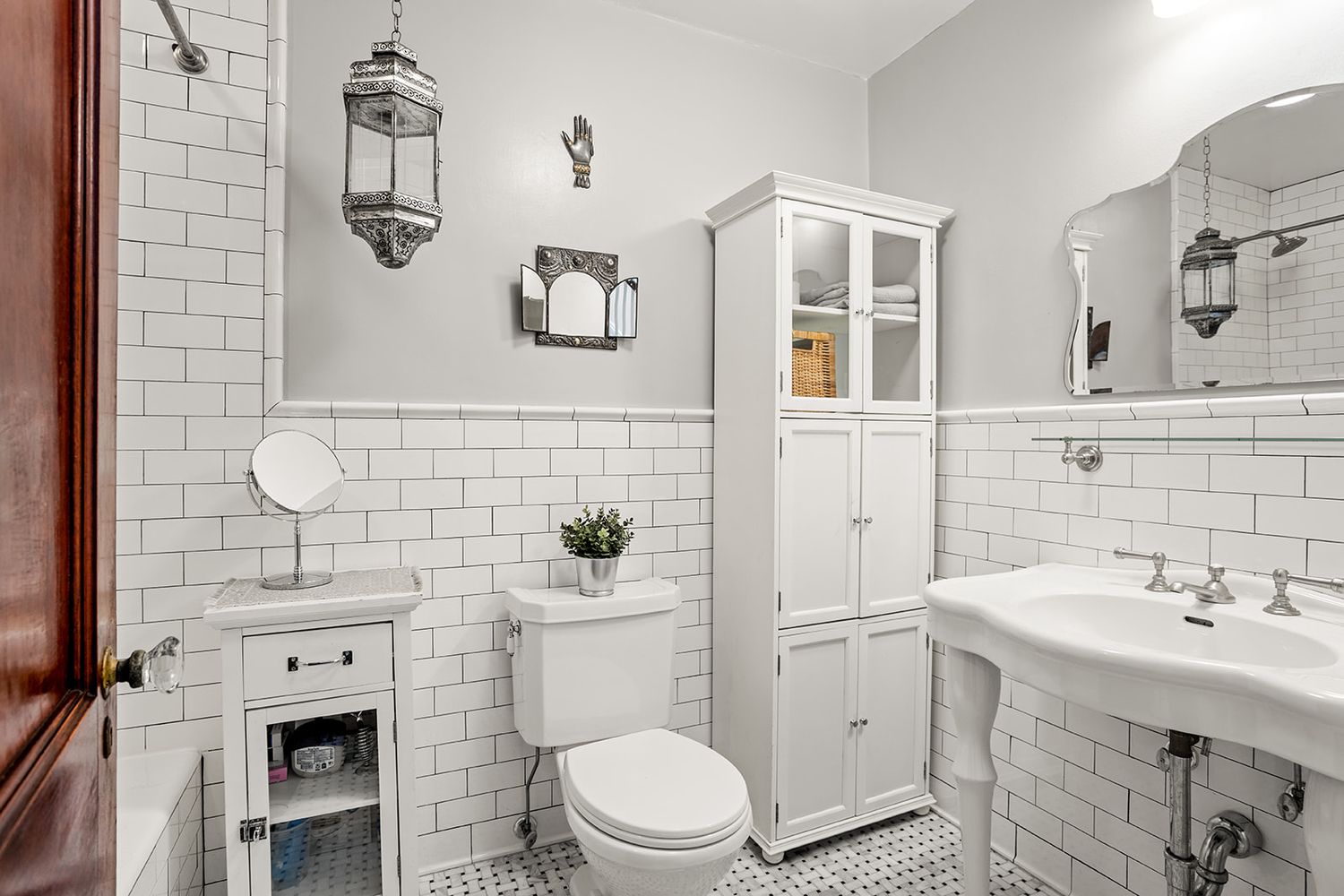 bathroom with white subway tile and white fixtures