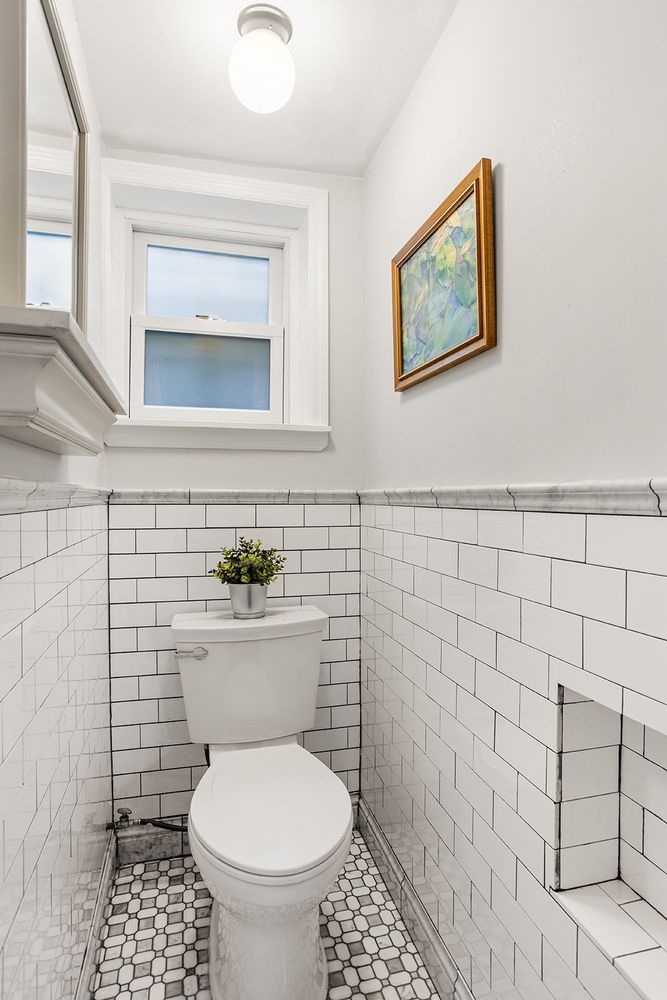 half bath with white subway tile