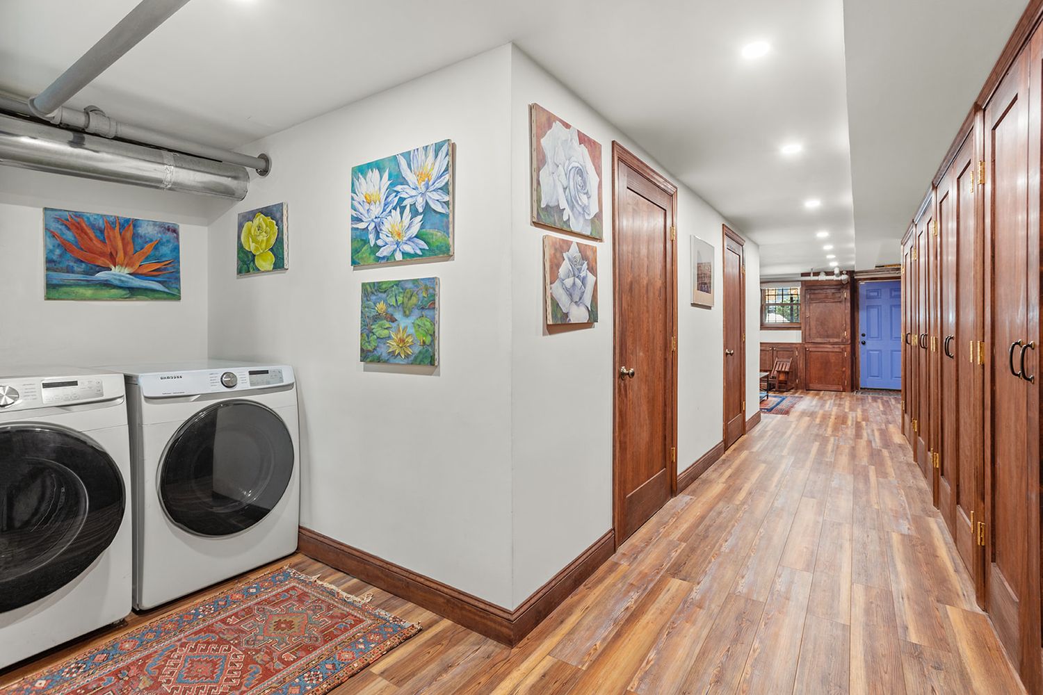 garden level laundry area and hall with built-in storage