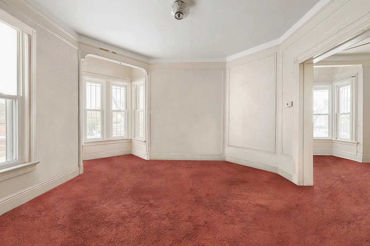 parlor with red wall-to-wall carpet