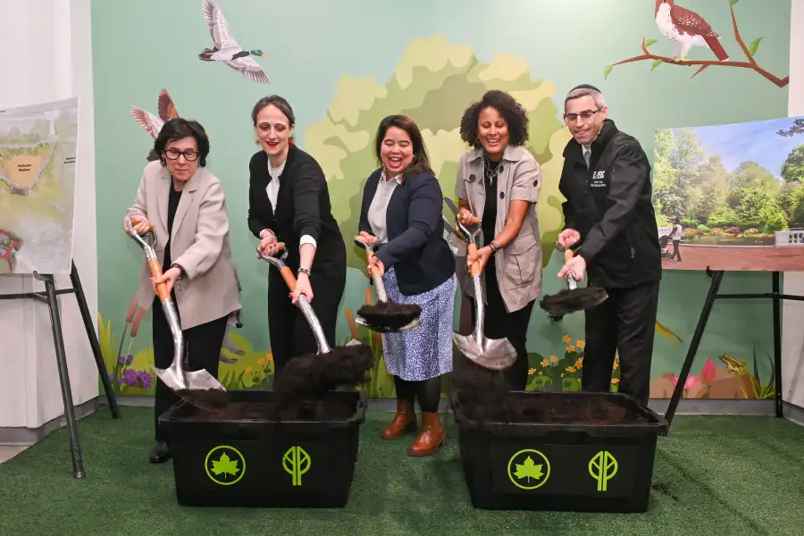 group posing with shovels