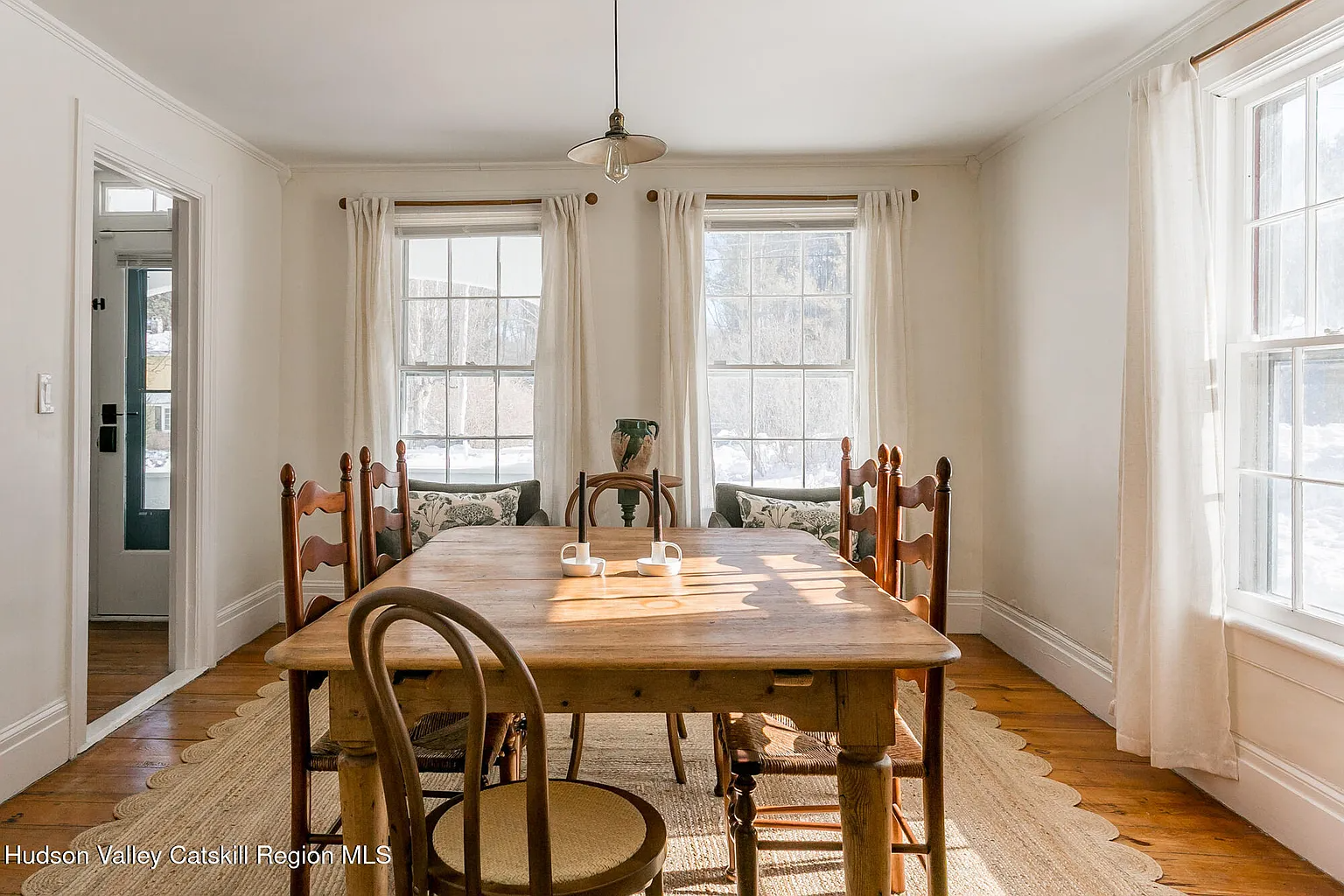 dining room with two exposures, wood floor