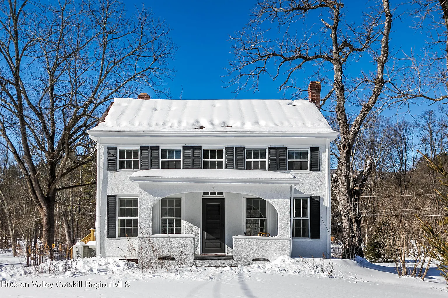 white stucco covered farmhouse