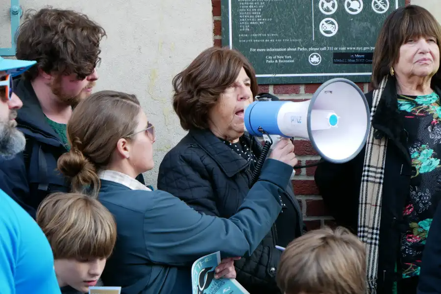 person speaking into a megaphone