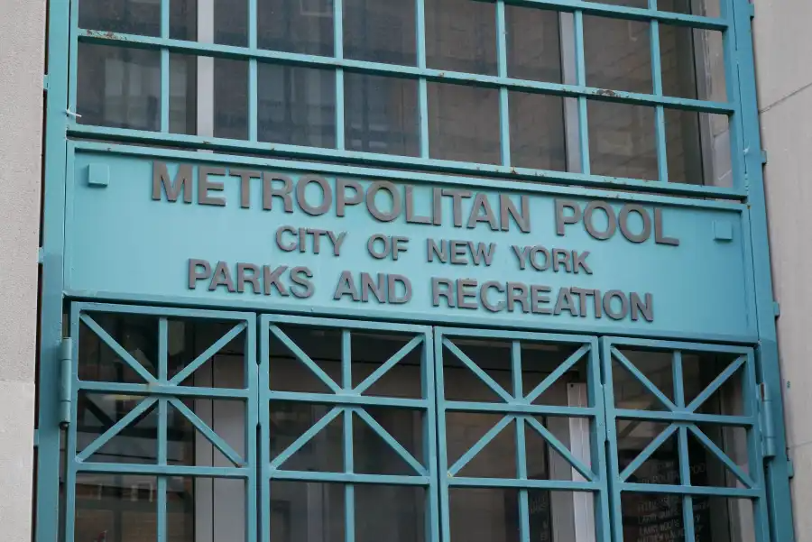sign at the front door for the metropolitan pool