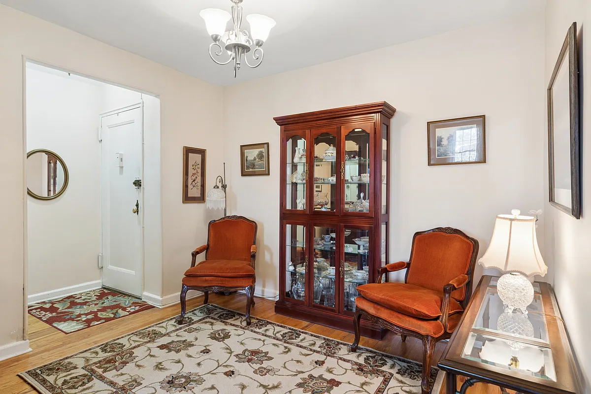 foyer with wood floor, beige walls