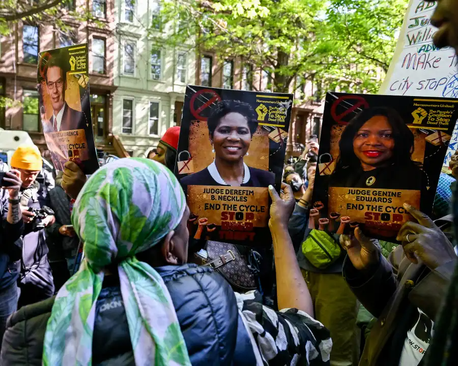people holding signs
