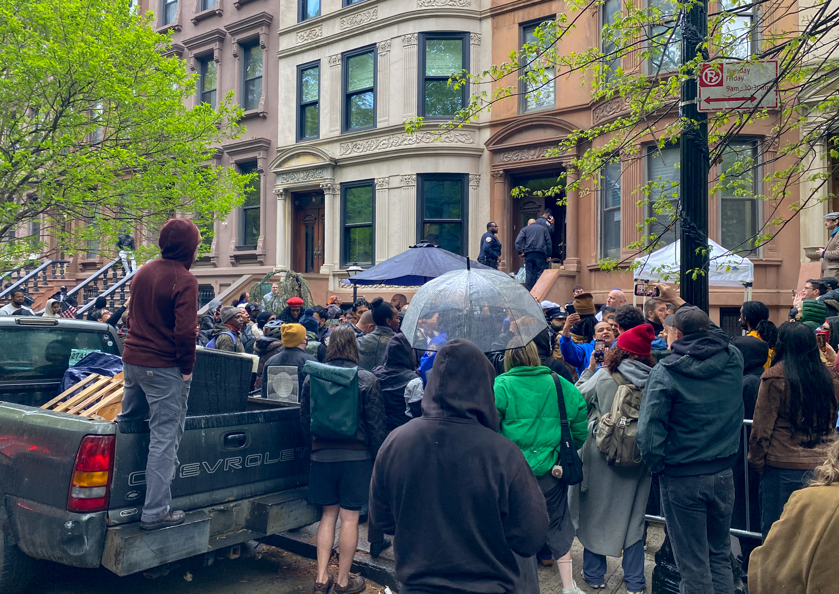 crown in front of a rowhouse