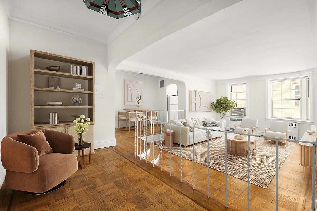 staged foyer with a book shelve and chair