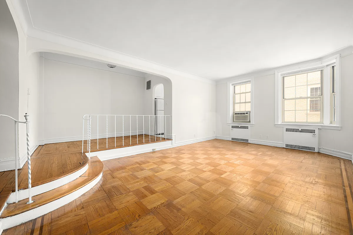 brooklyn heights - sunken living rom with wood floor, iron railing
