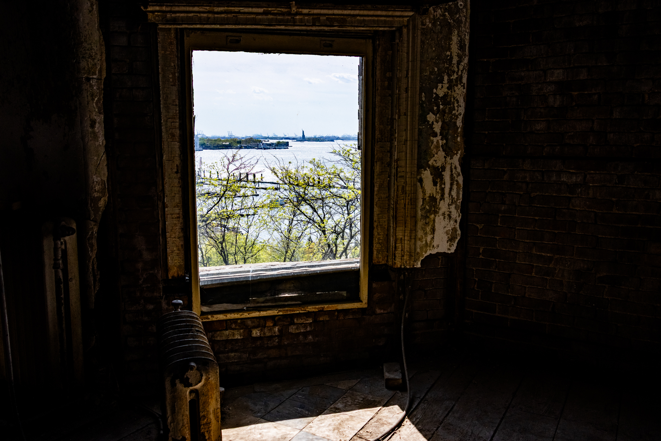 window with view of the statue of liberty