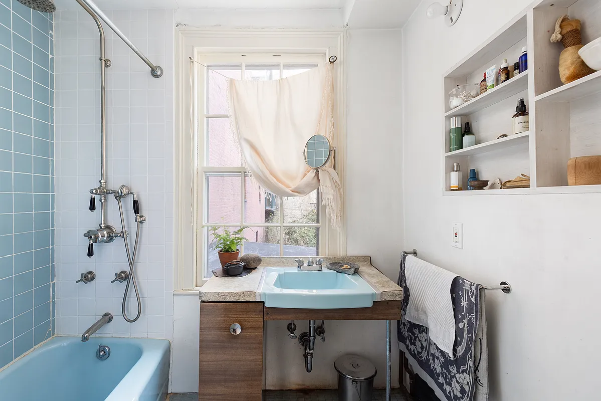 bathroom with blue tub
