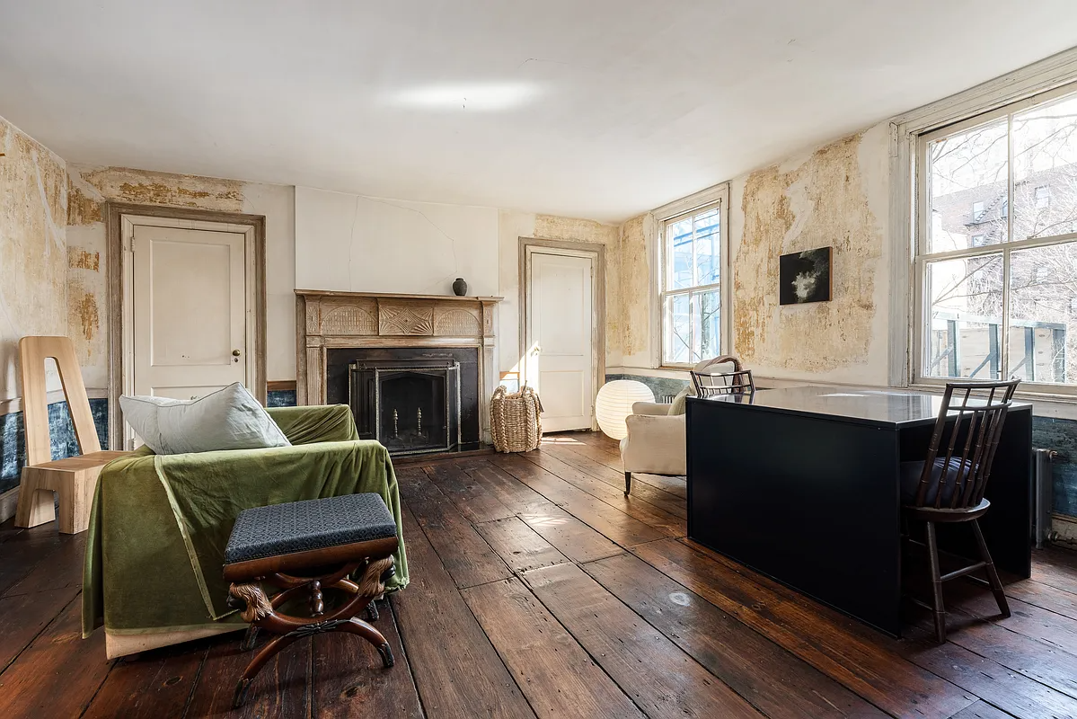 bedroom as office with a mantel