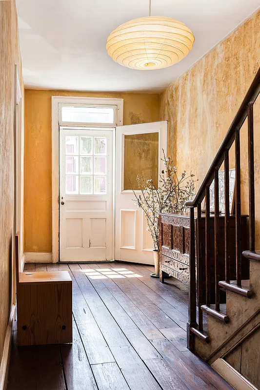 entry hall with wide planked floorboards