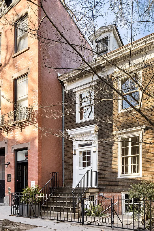 exterior of a shingle-covered house with dormers