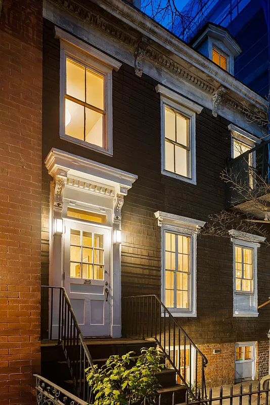 exterior of a shingle-covered house with dormers