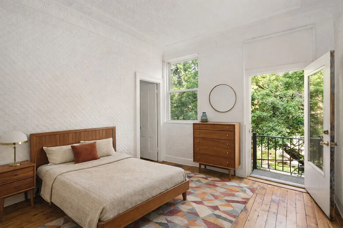 bedroom with door to rear deck