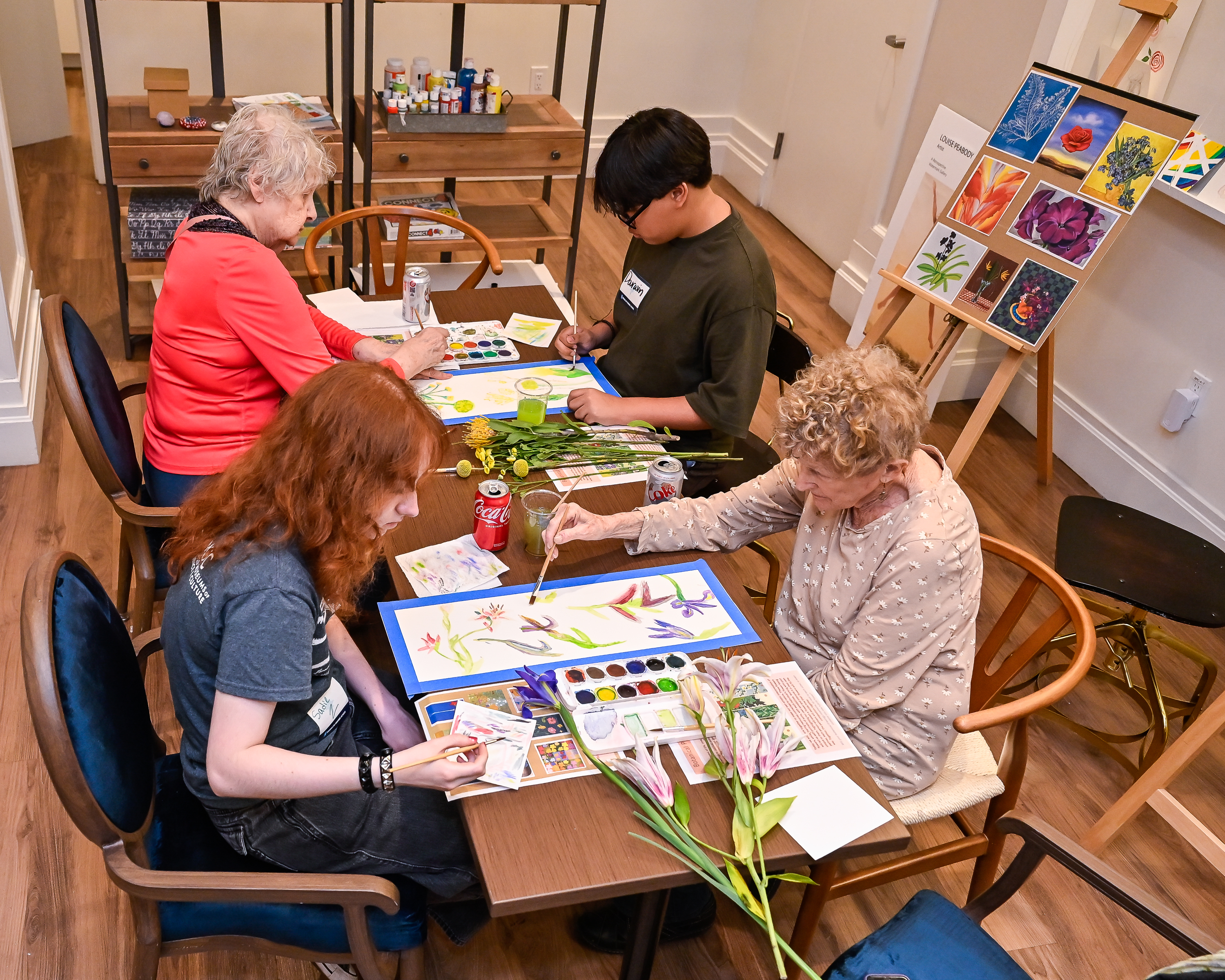 group at a table with flowers