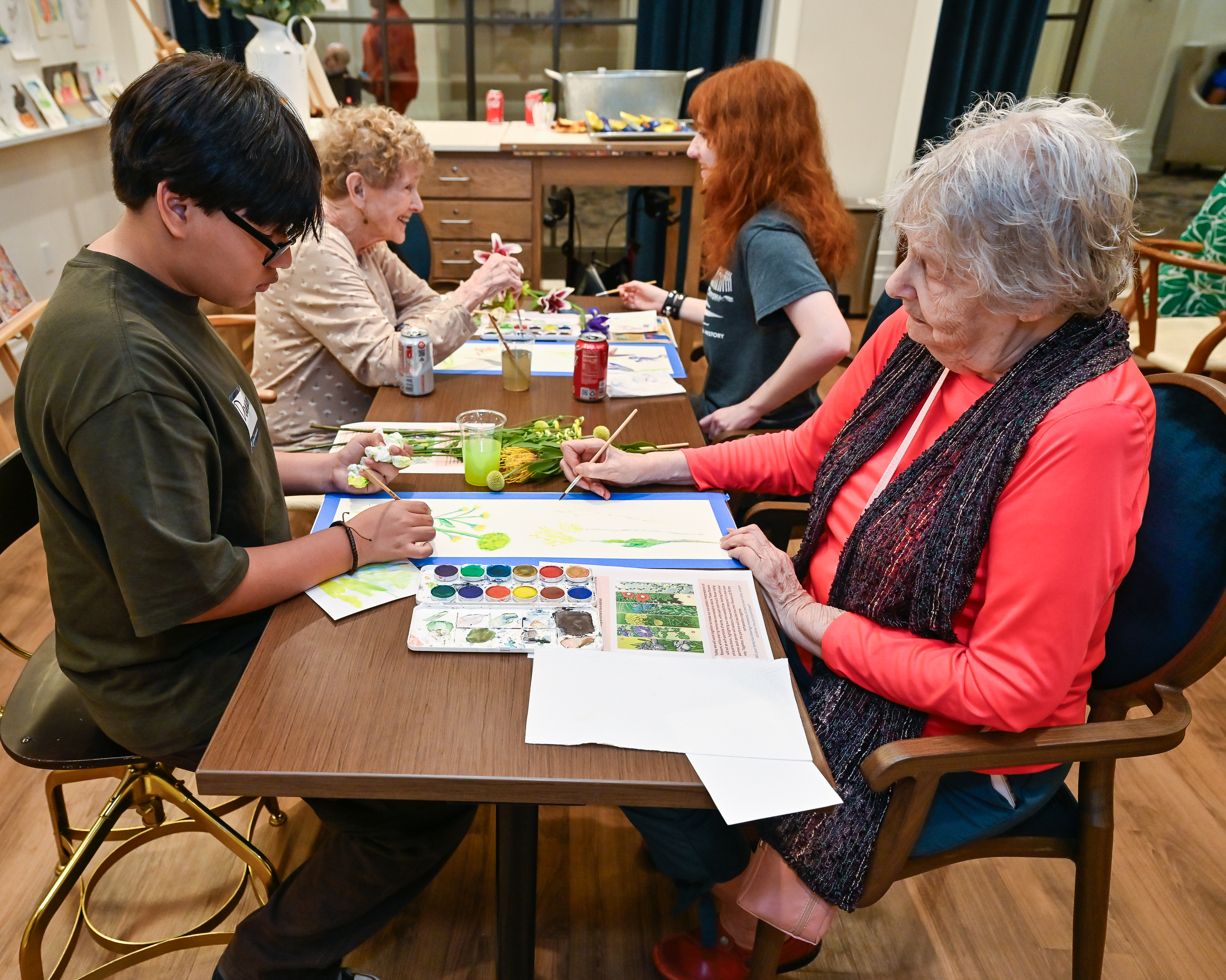 people working on art at a table