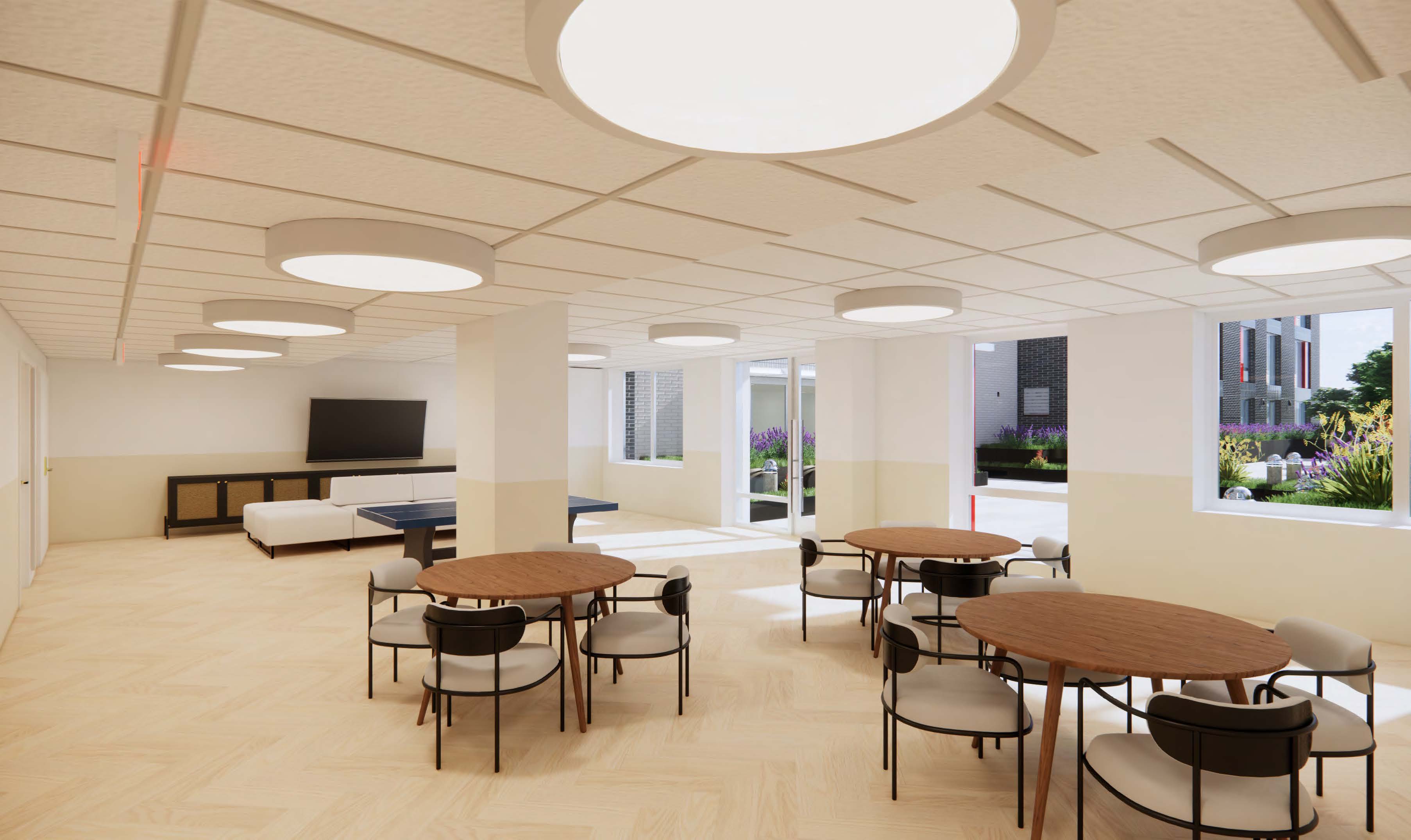rendering of a common room with tables and chairs