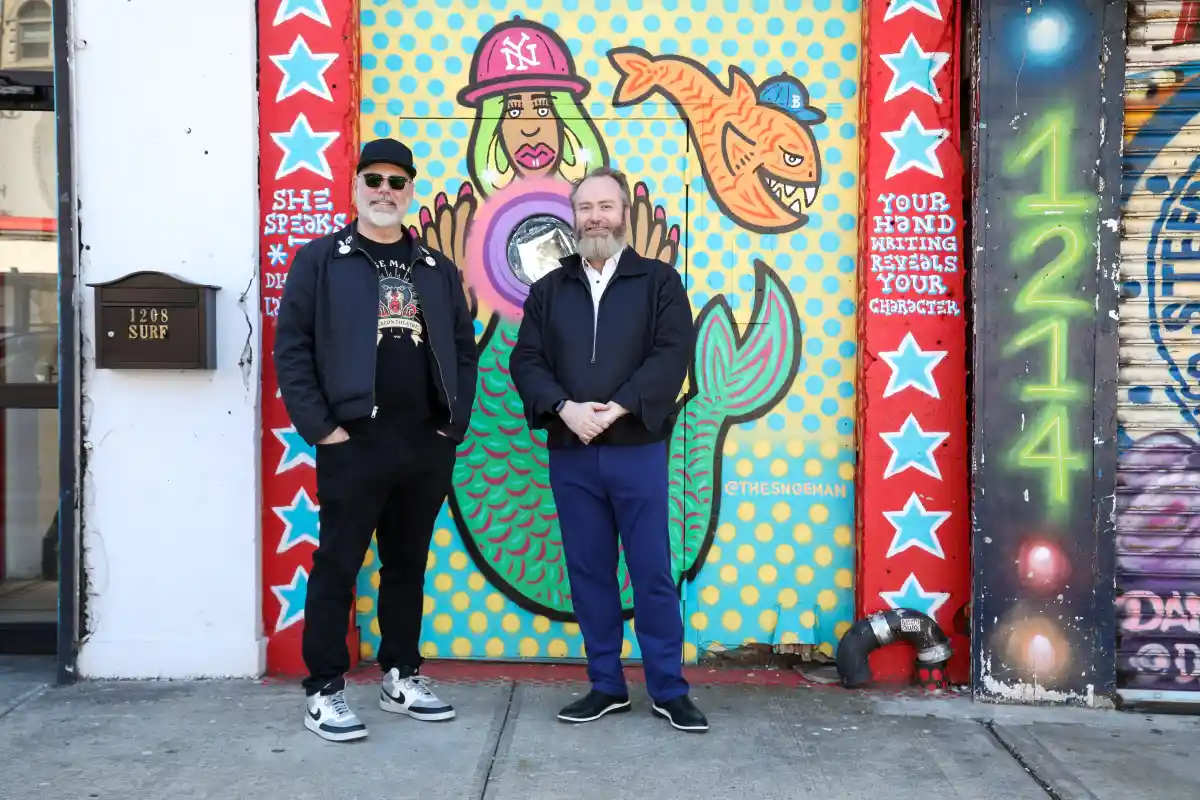 coney island - people posing in front of a mural of a mermaid