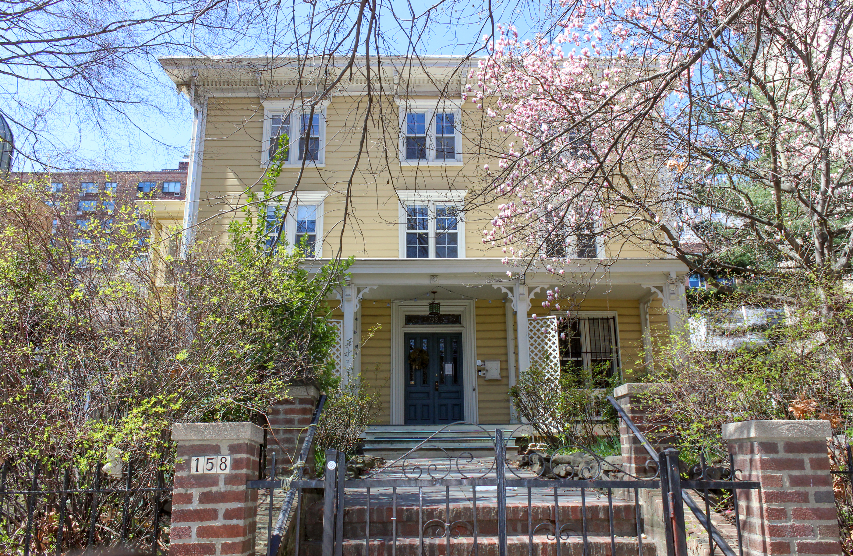 fort greene - a yellow wood frame house