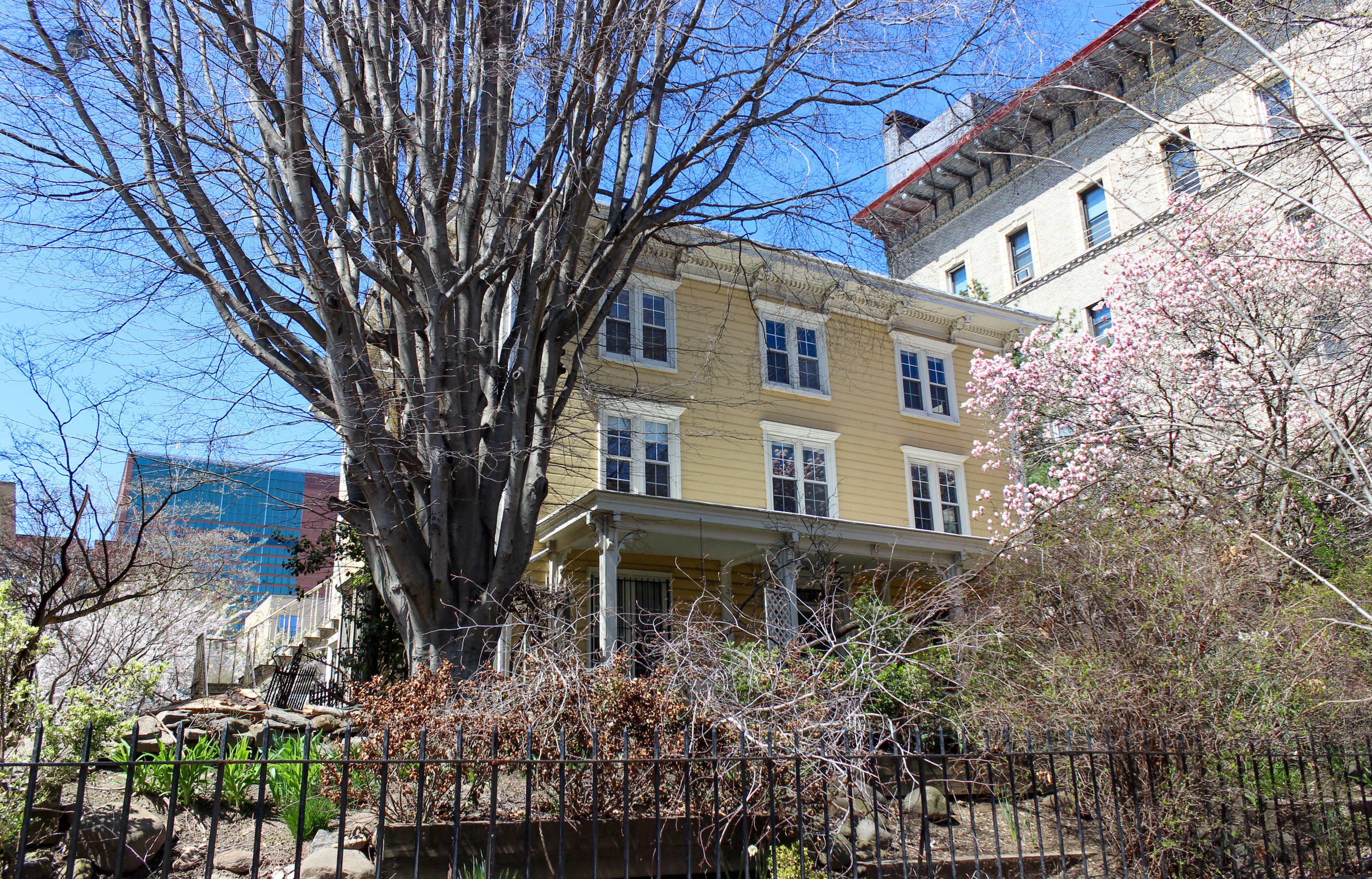 a yellow, wood frame house
