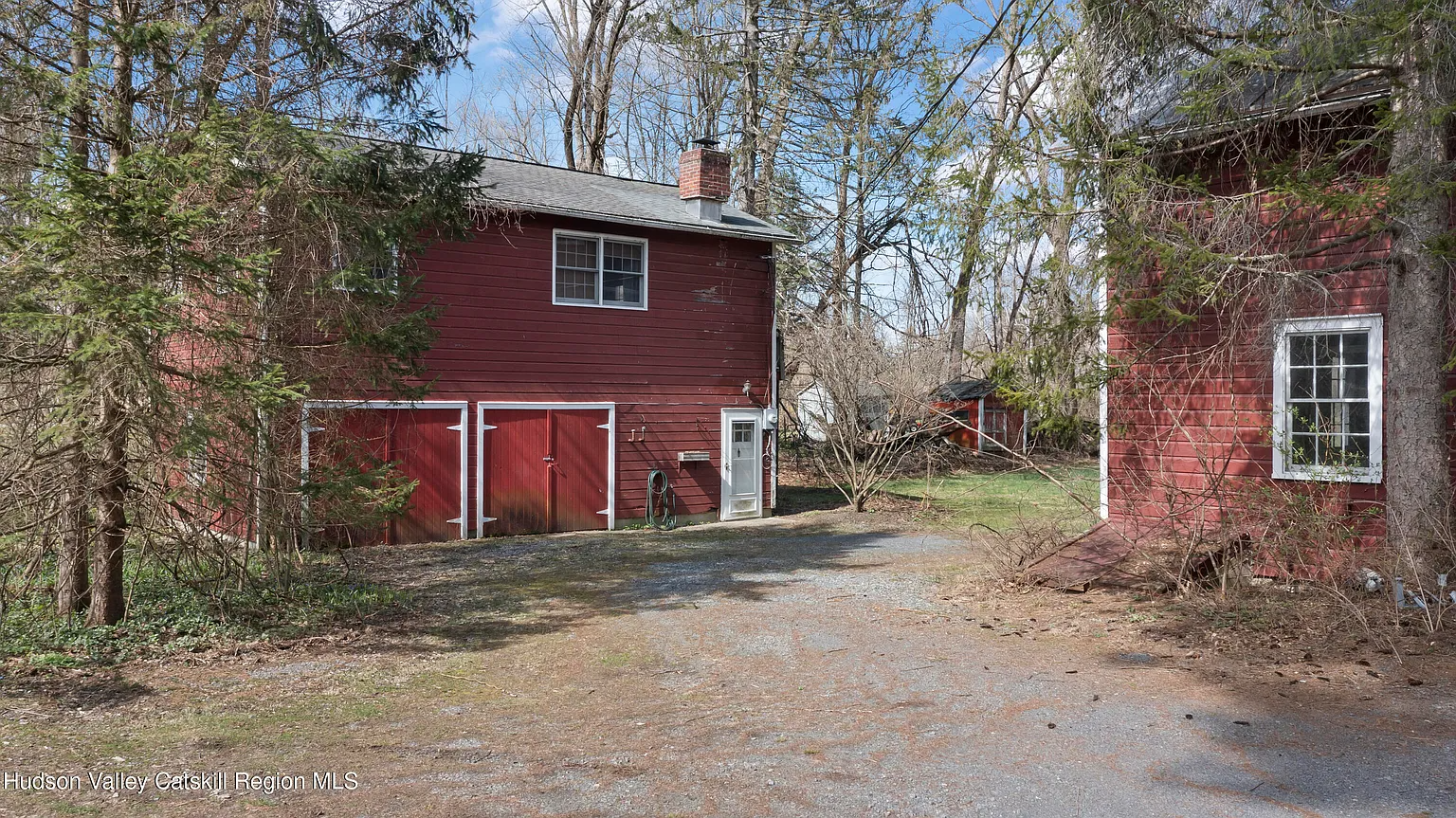 two red sided outbuildings
