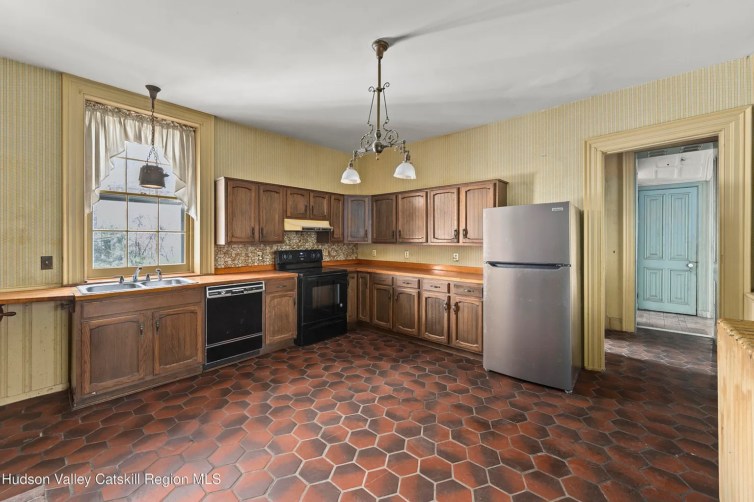 kitchen with1970s cabinets, orange Formica counters