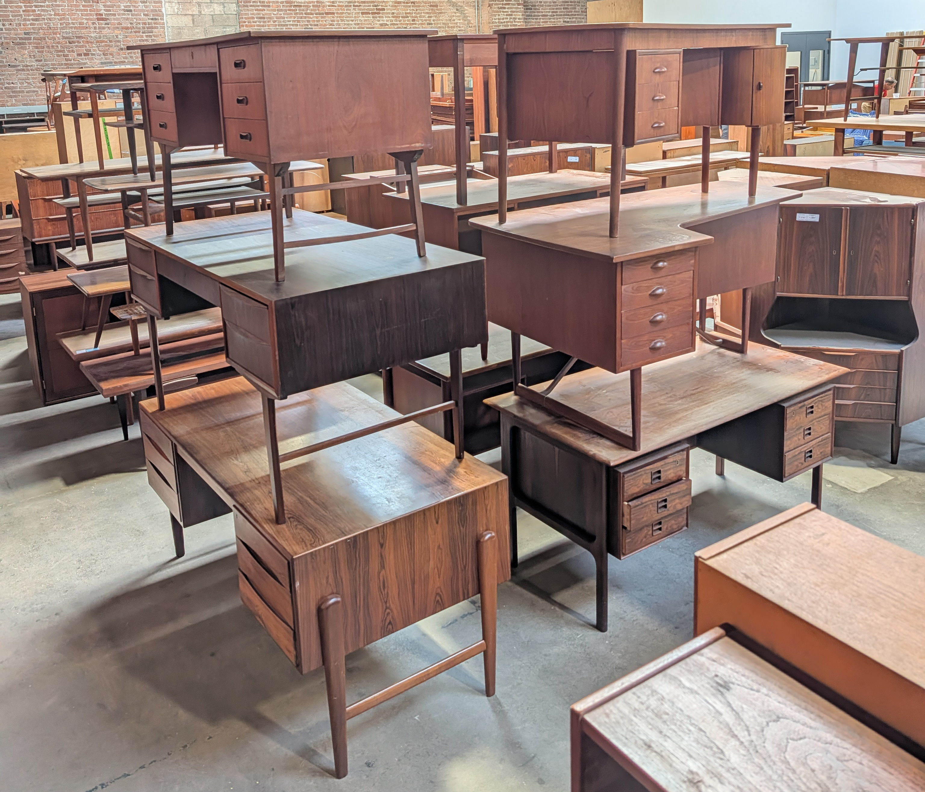 stack of wooden desks