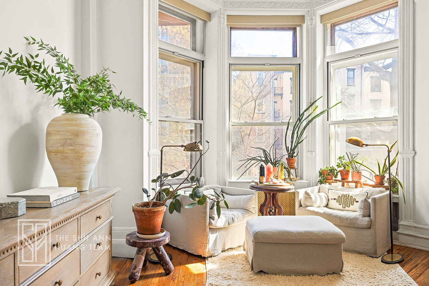 bedroom with seating area in bay window