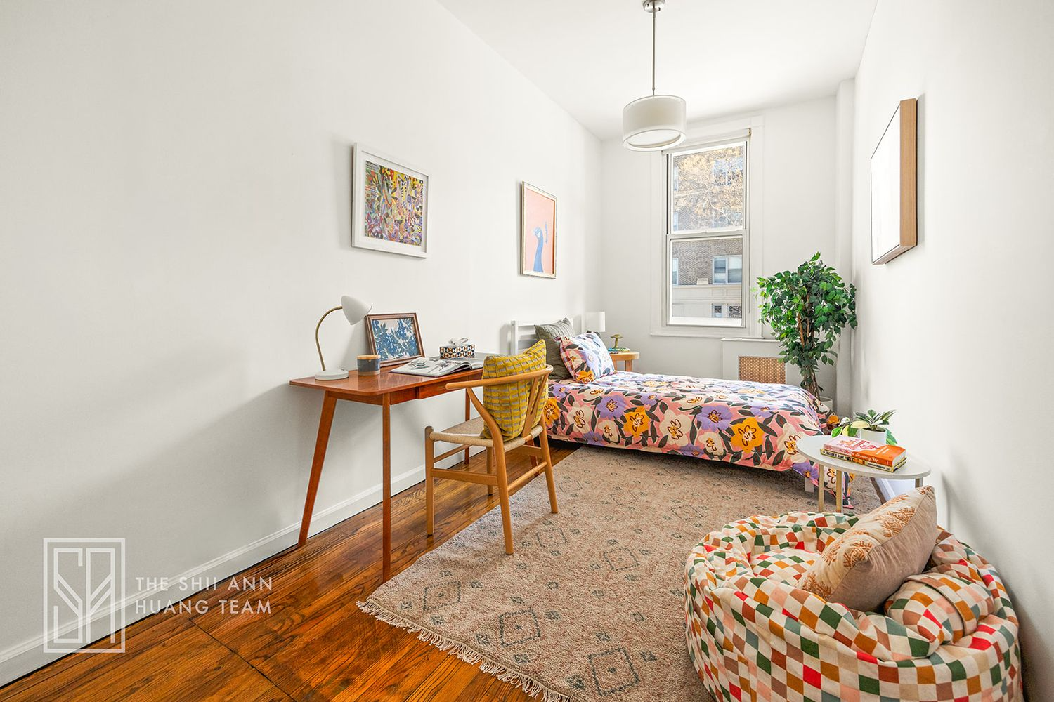 bedroom with wood floor, one window
